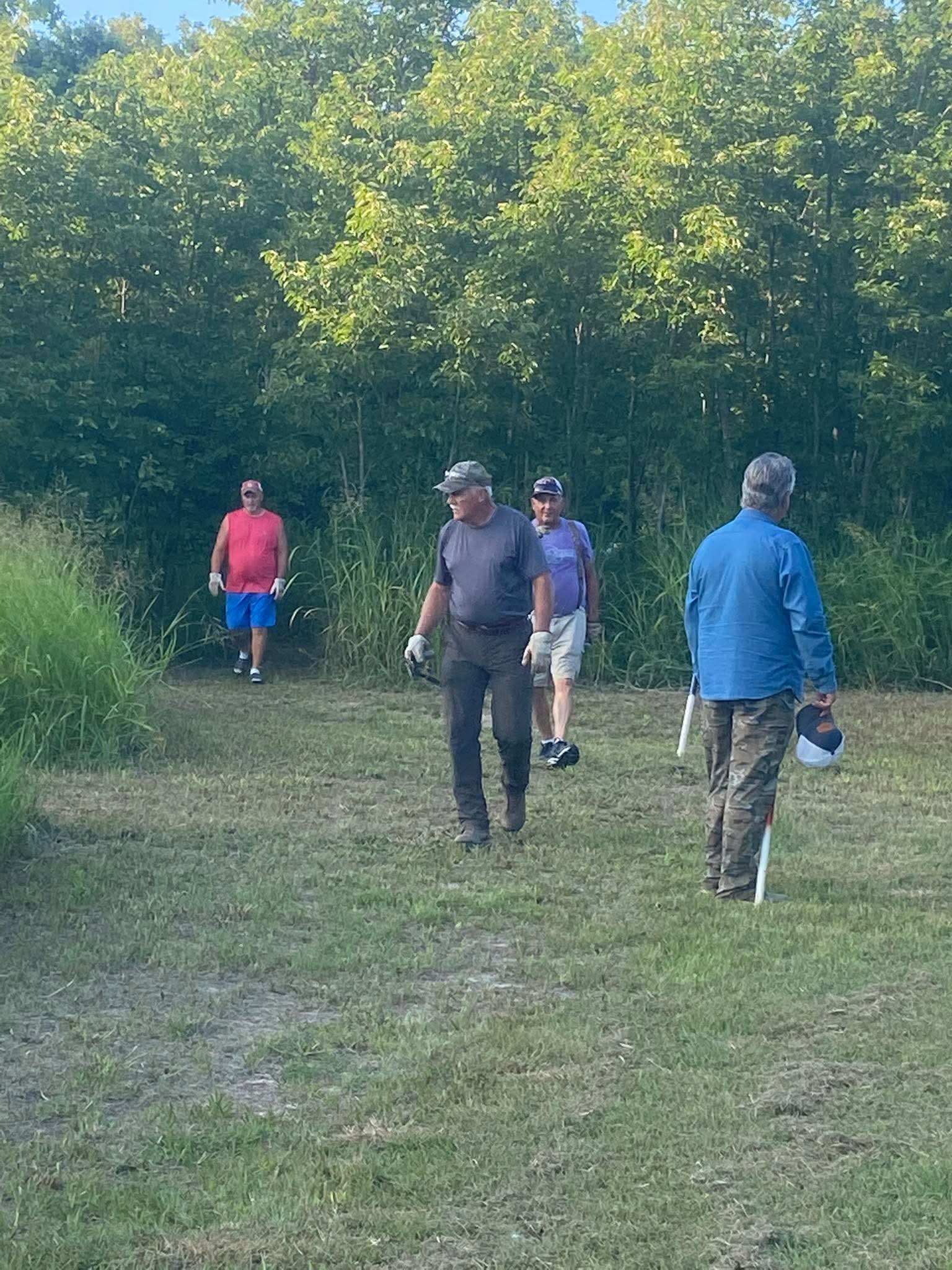 Club volunteers working together on the outdoor course